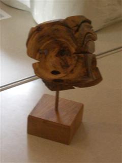 Multi faced cube sweet chestnut burr on pedestal by John Holmes